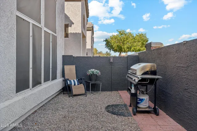a dining room with furniture and a chandelier