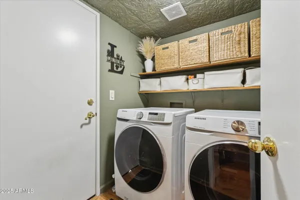 a utility room with dryer and washer
