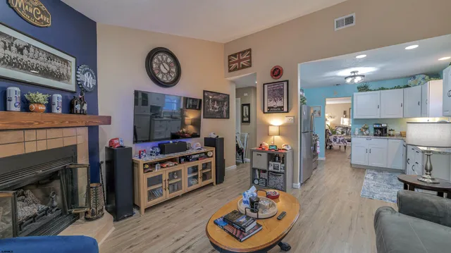 a living room with furniture and a fireplace