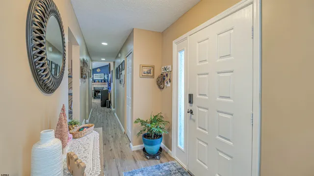 a view of an entryway with wooden floor