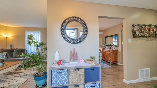 a living room with furniture and a potted plant