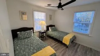 a bedroom with a bed couch and window