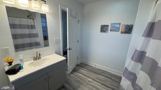 1546 Savannah Road Lewes, DE 19958 - Photo 6 of 8 a bathroom with a sink and a mirror