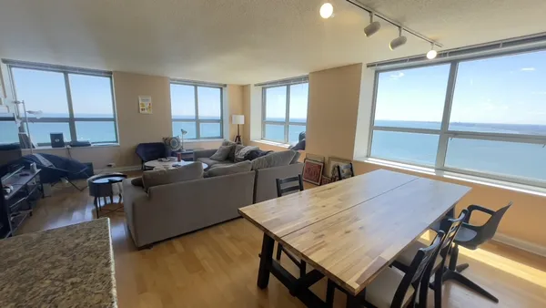 a view of a dining room with furniture window and outside view