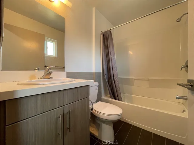 a bathroom with a sink a toilet and a bathtub