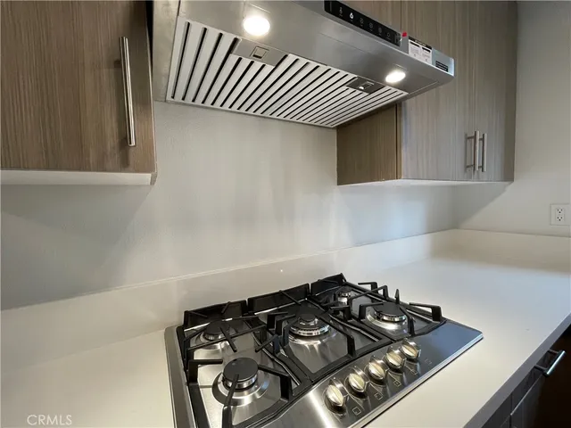 a close up of a stove top oven sitting inside of a kitchen