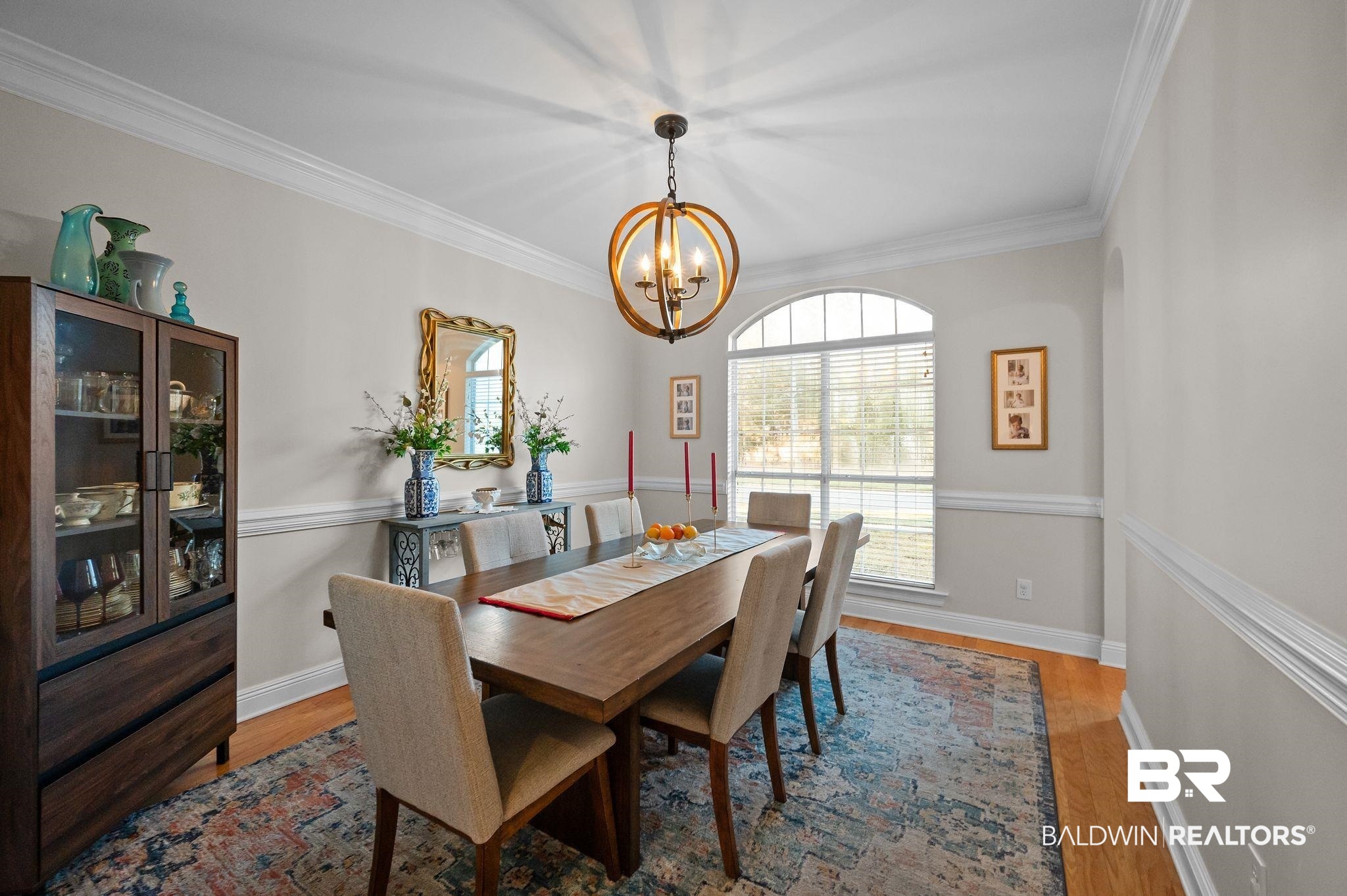 1825 Spring Hill Avenue Mobile, AL 36607 - Photo 8 of 43 Dining area featuring light wood-style flooring, ornamental molding, and a chandelier