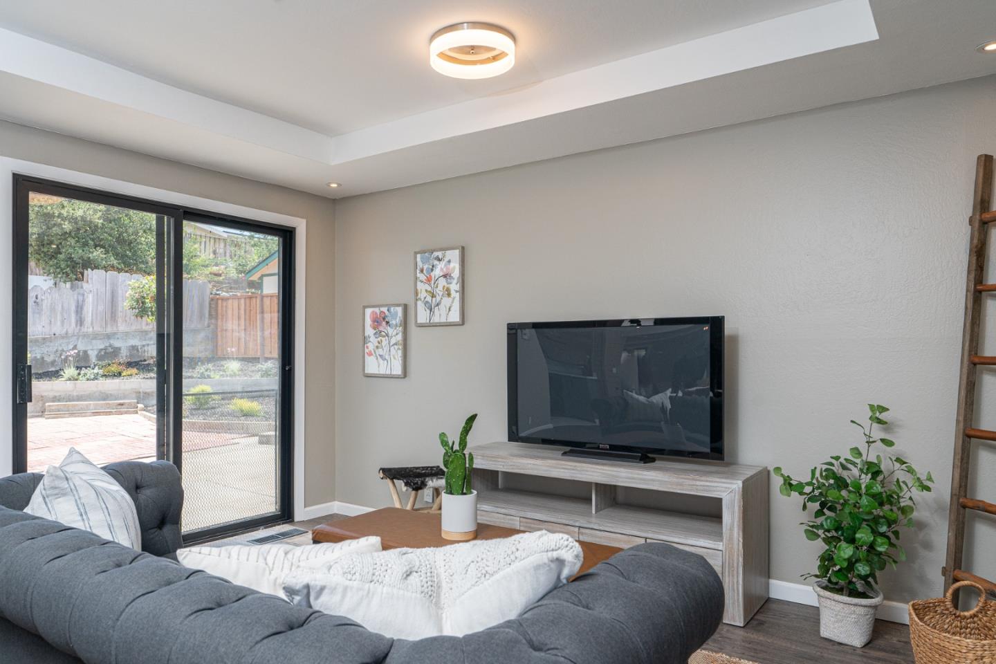 1055 Tweed Street Seaside, CA 93955 - Photo 11 of 33 a living room with furniture and a flat screen tv