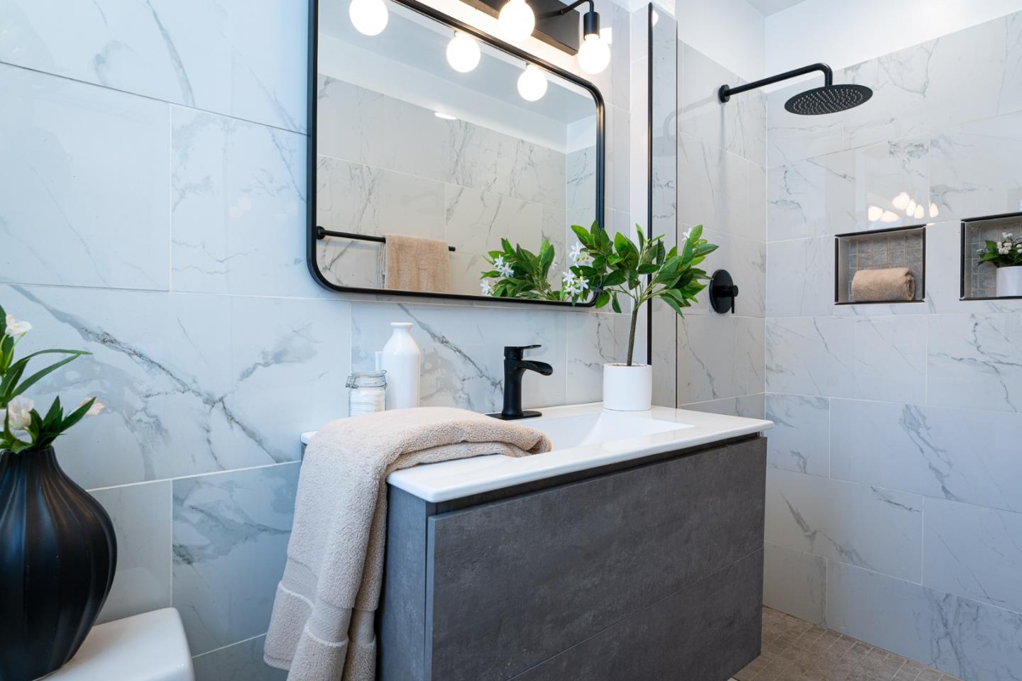 1055 Tweed Street Seaside, CA 93955 - Photo 14 of 33 a bathroom with a sink a toilet and mirror