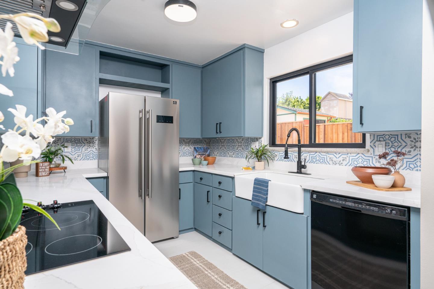 1055 Tweed Street Seaside, CA 93955 - Photo 5 of 33 a kitchen with granite countertop a sink stove and refrigerator