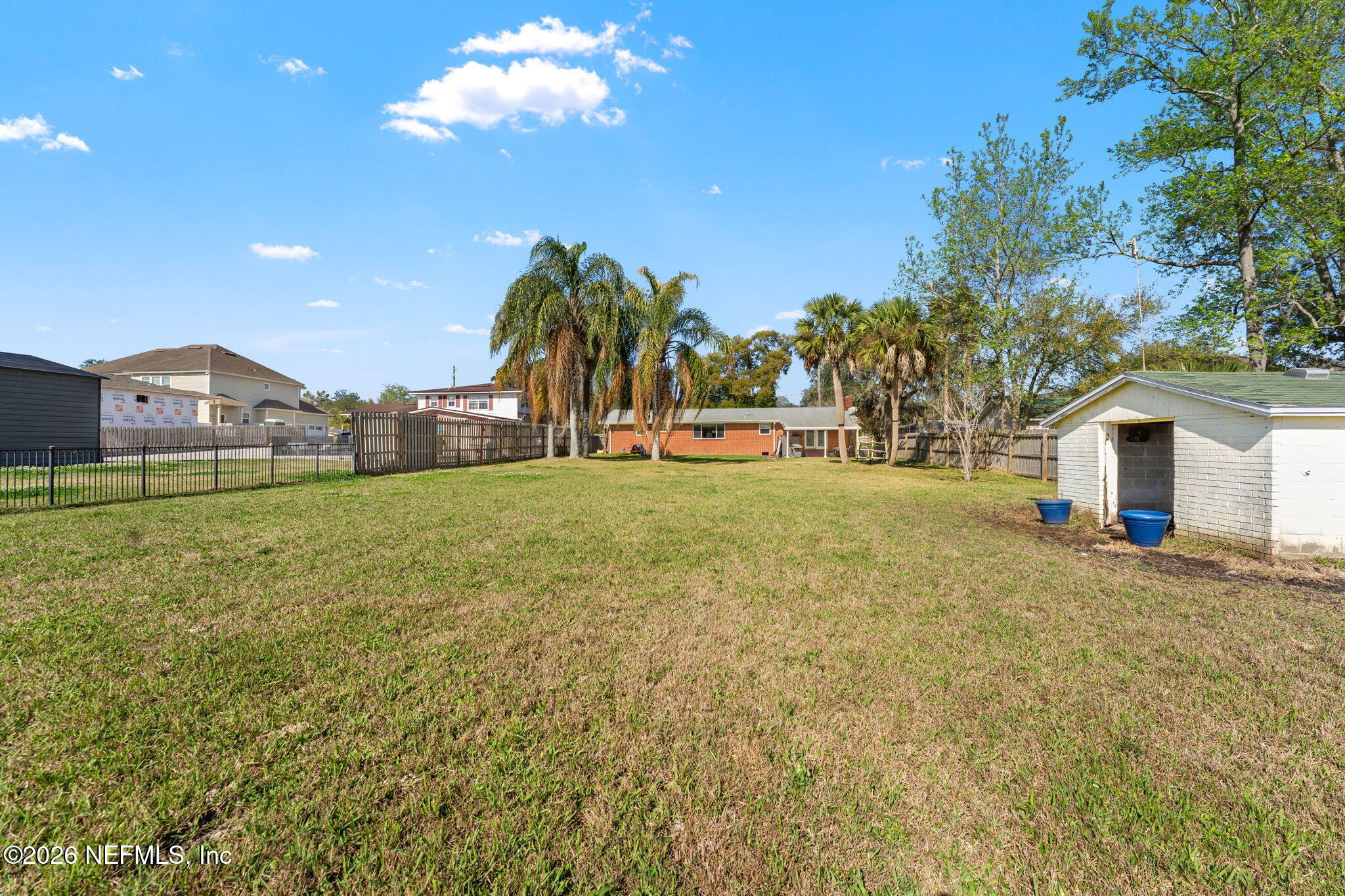 284 Baisden Road Jacksonville, FL 32218 - Photo 11 of 39 a view of a house with a yard and garage