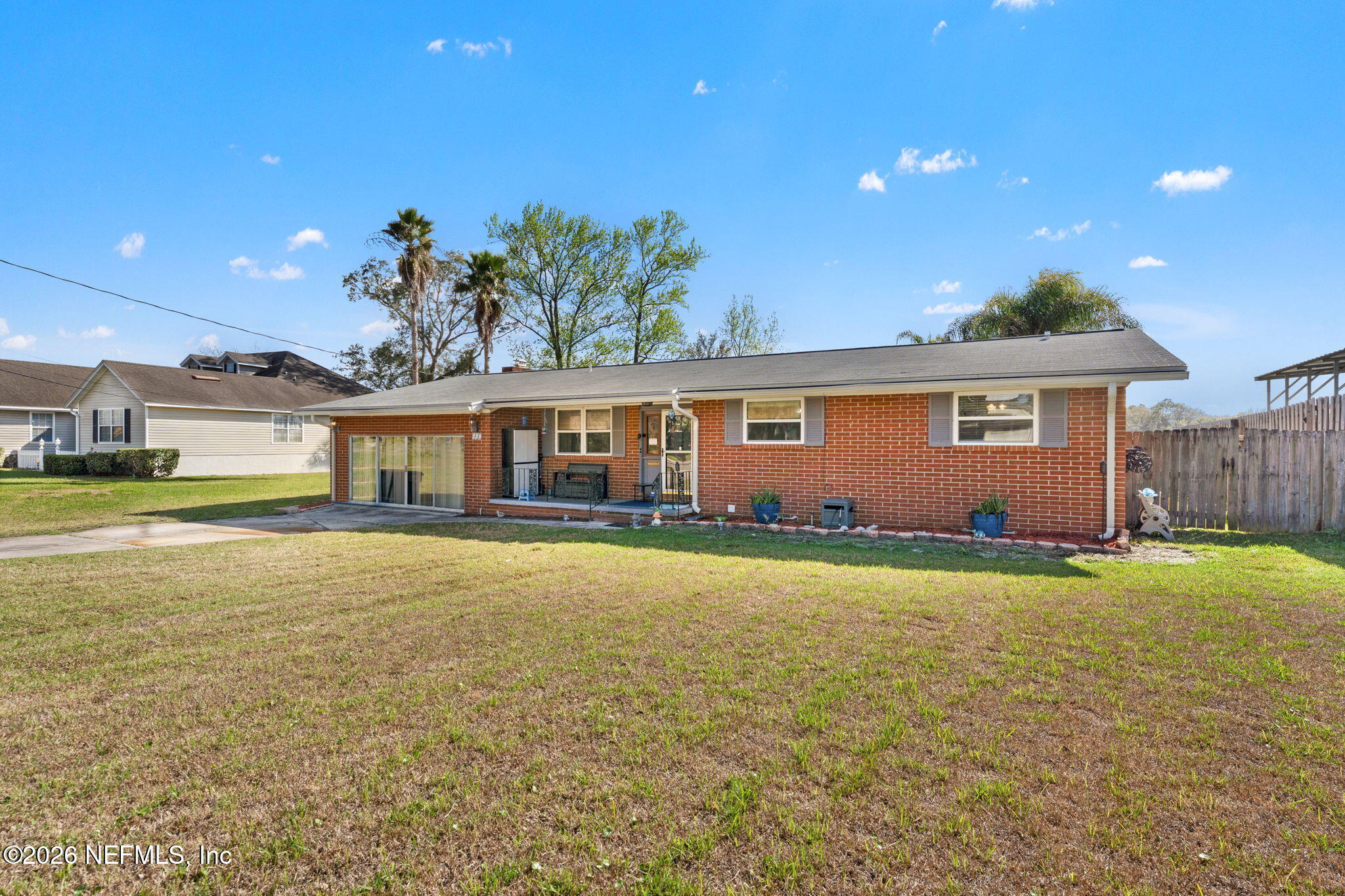 284 Baisden Road Jacksonville, FL 32218 - Photo 16 of 39 a view of an house with swimming pool and a yard