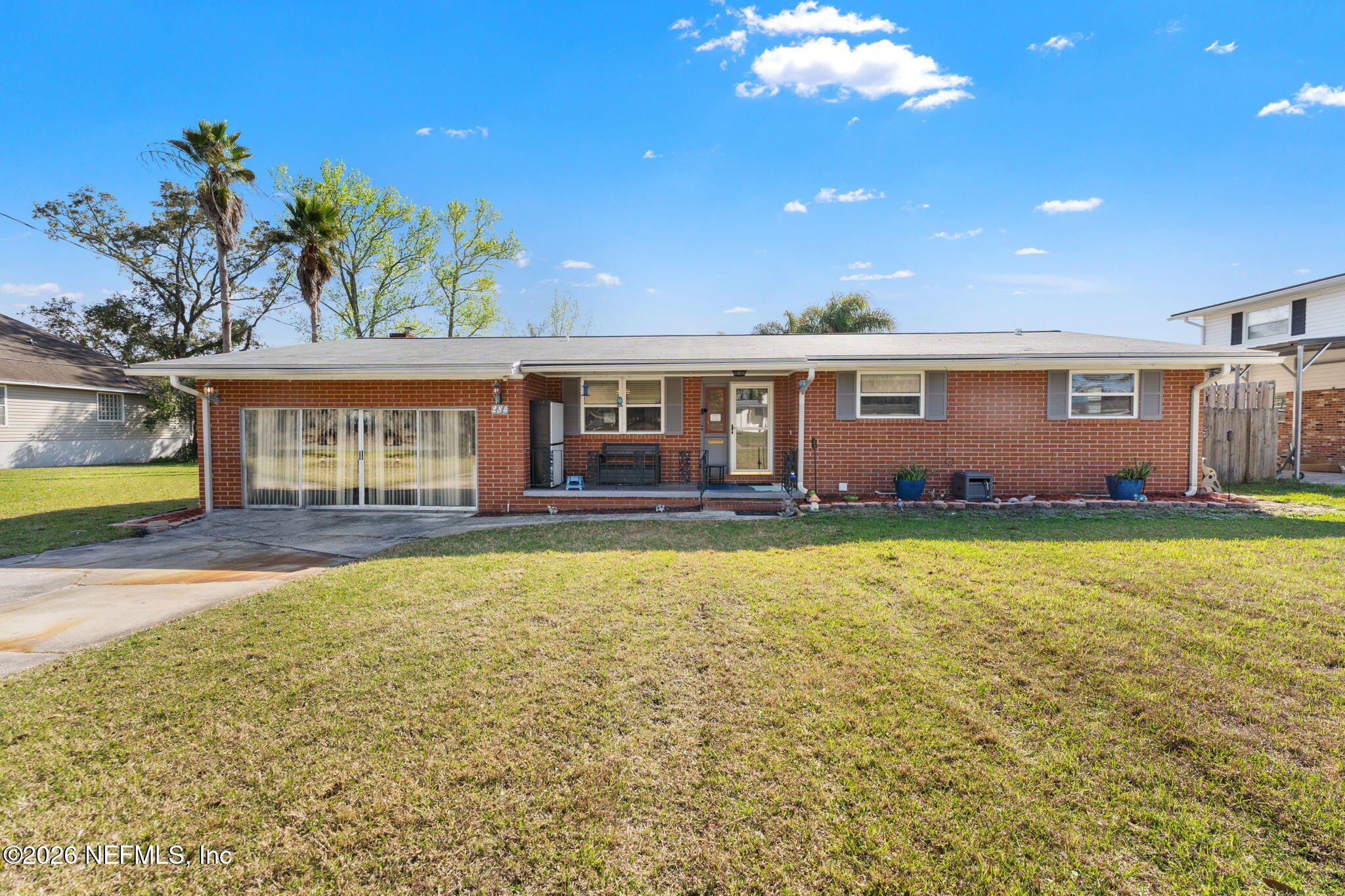 284 Baisden Road Jacksonville, FL 32218 - Photo 17 of 39 a view of a house with swimming pool and a yard