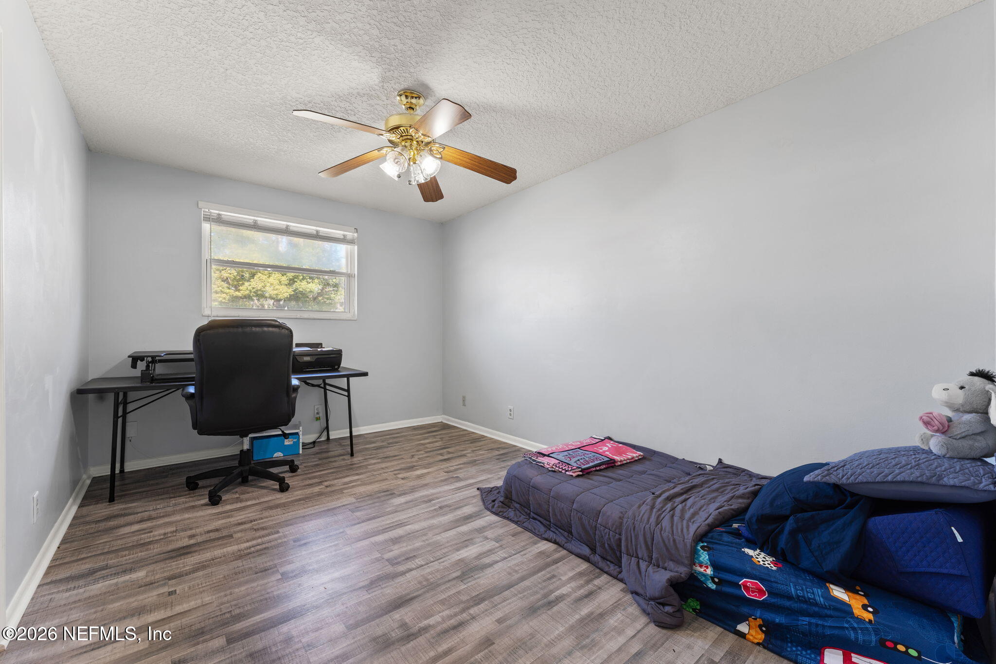 284 Baisden Road Jacksonville, FL 32218 - Photo 19 of 39 a living room with furniture and a chair