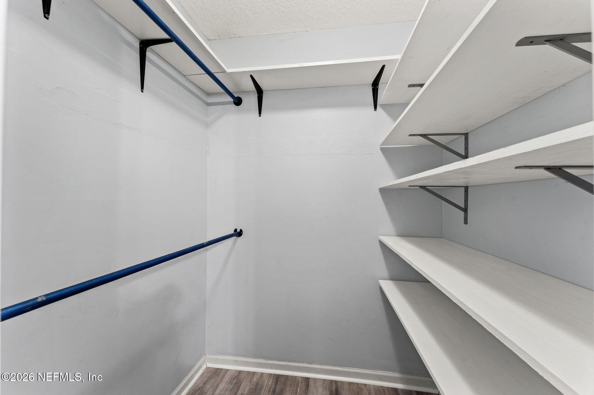 284 Baisden Road Jacksonville, FL 32218 - Photo 22 of 39 a view of walk in closet with empty racks