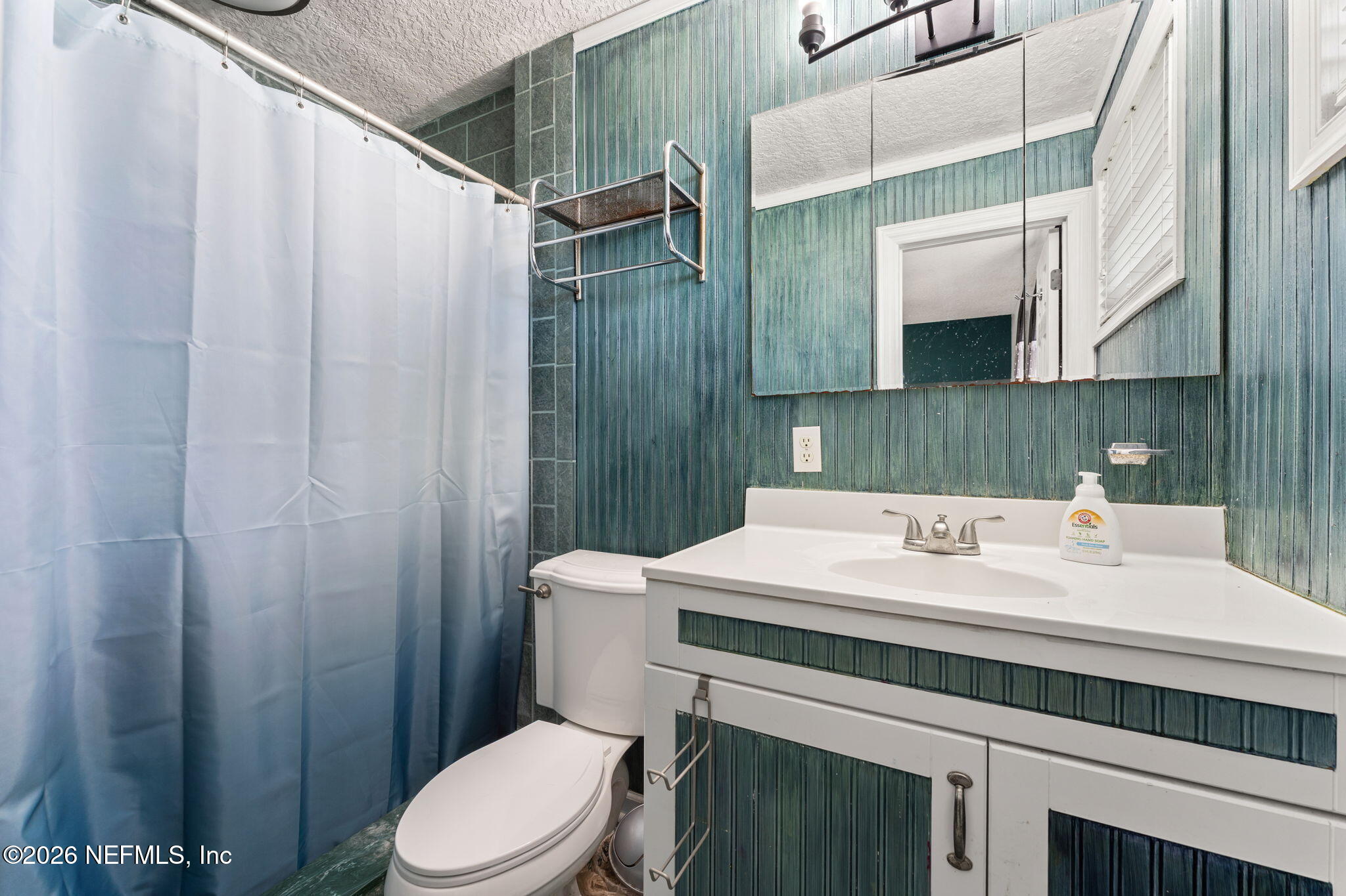 284 Baisden Road Jacksonville, FL 32218 - Photo 23 of 39 a bathroom with a sink a toilet and shower