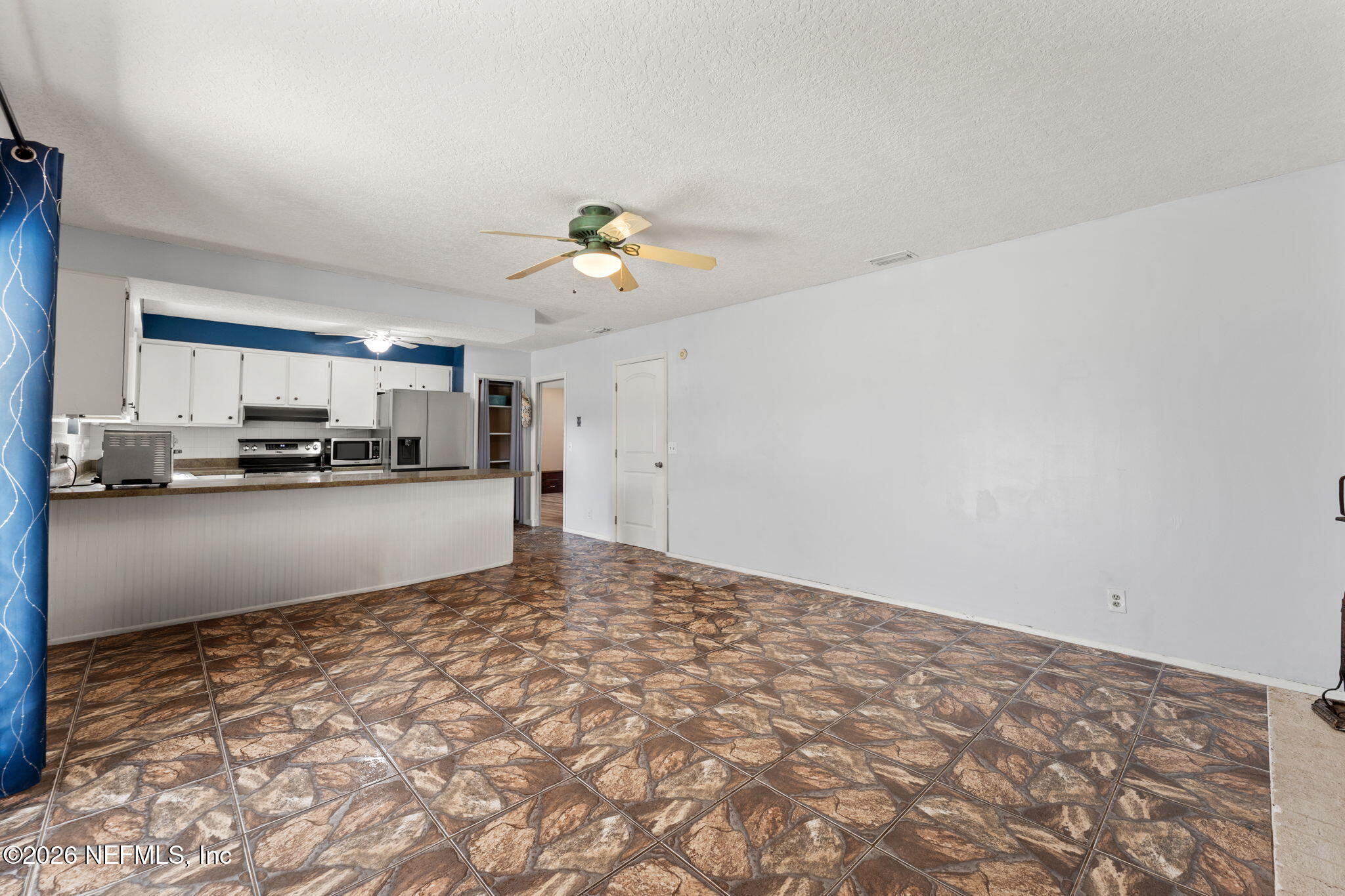 284 Baisden Road Jacksonville, FL 32218 - Photo 27 of 39 a view of empty room with wooden floor