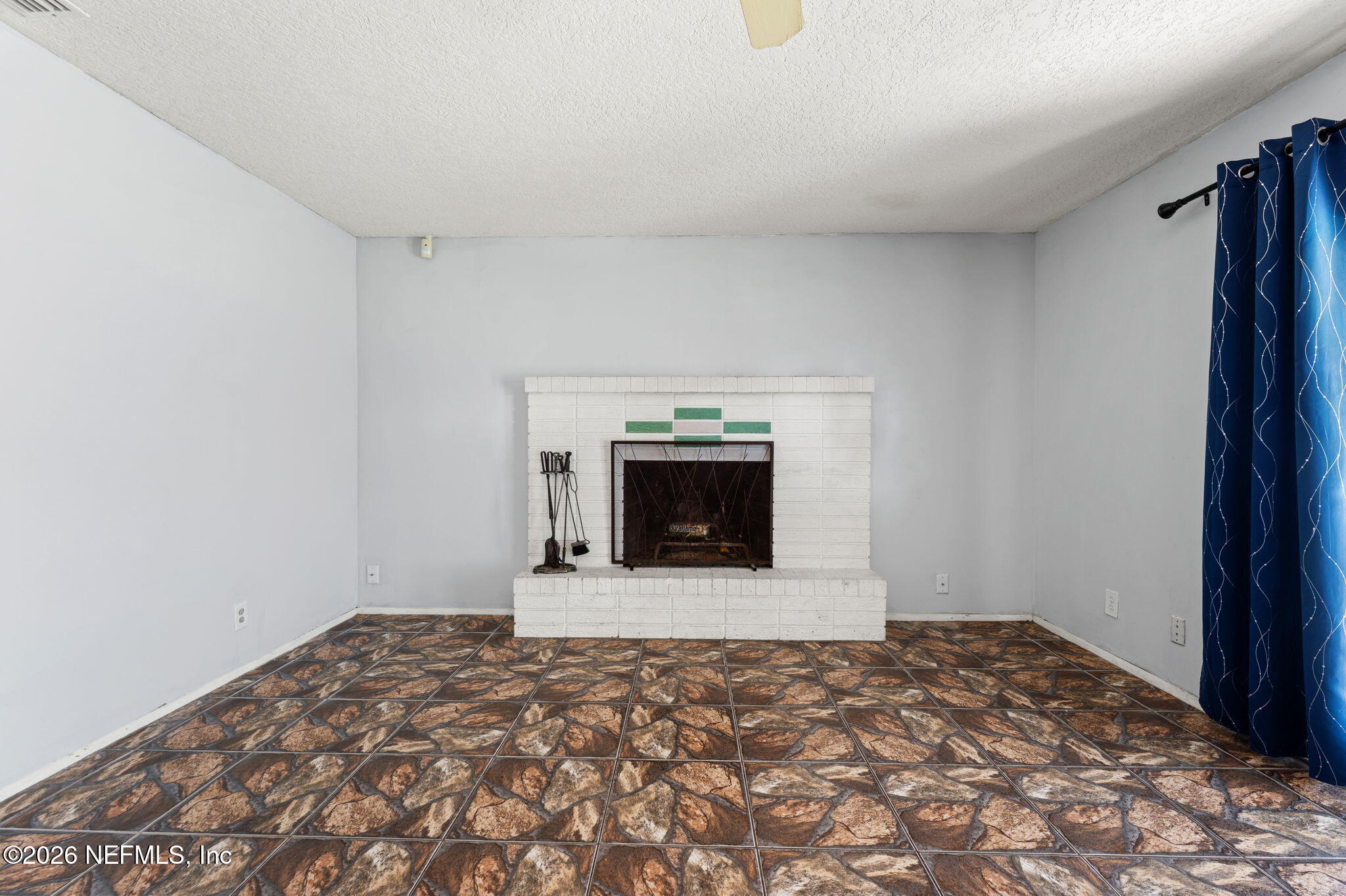 284 Baisden Road Jacksonville, FL 32218 - Photo 28 of 39 a view of empty room with a fireplace