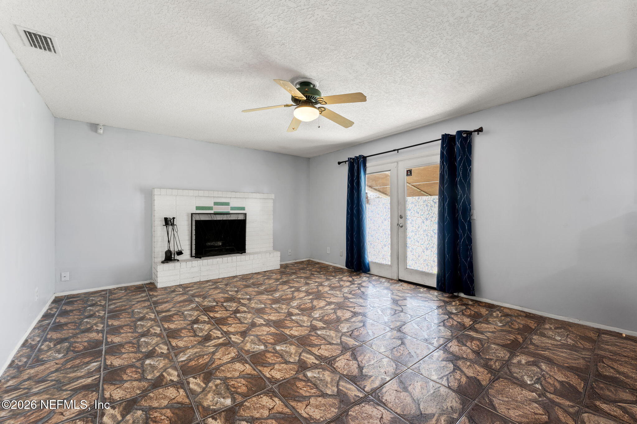 284 Baisden Road Jacksonville, FL 32218 - Photo 29 of 39 a view of empty room with a fireplace