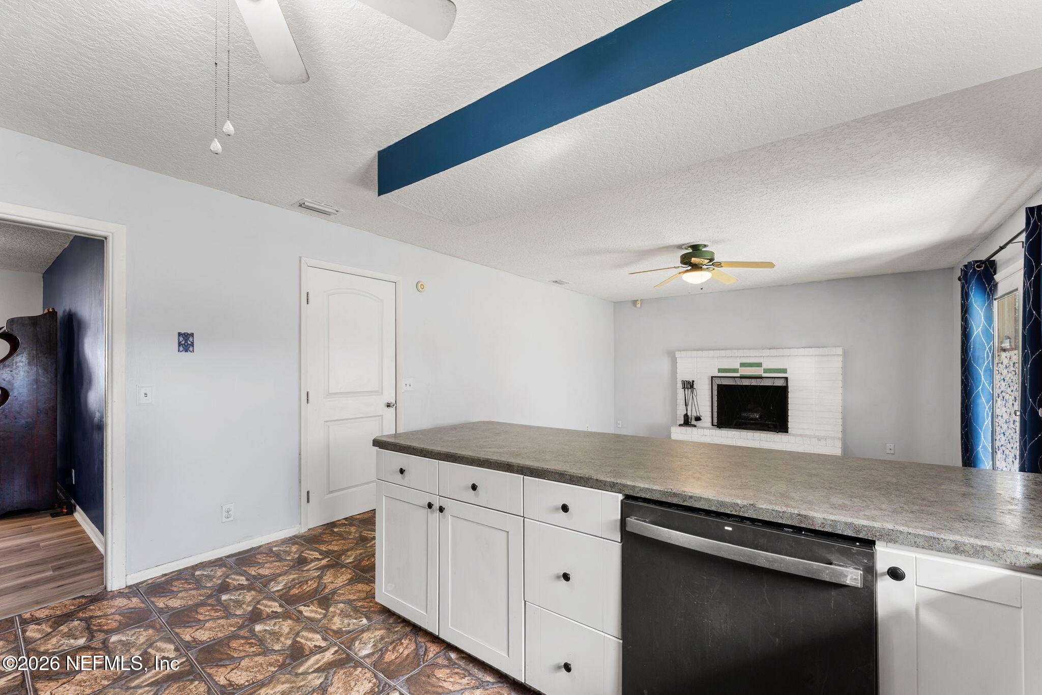 284 Baisden Road Jacksonville, FL 32218 - Photo 32 of 39 a kitchen with granite countertop white cabinets and a sink