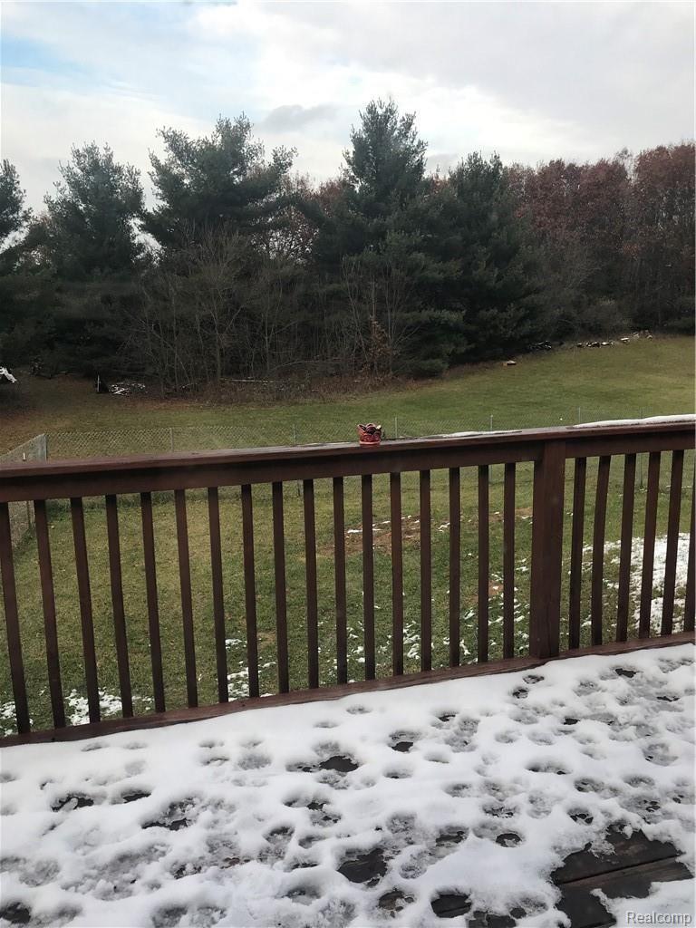 7582 West Beard Road Perry, MI 48872 - Photo 18 of 35 View off deck into backyard, Partial area fenced.