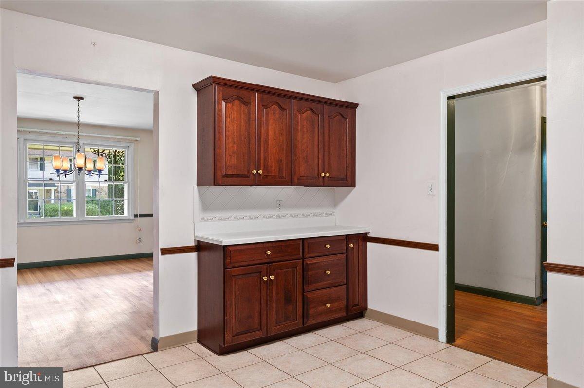 2539 Raven Road Wilmington, DE 19810 - Photo 16 of 39 Inviting kitchen space with rich cabinetry.