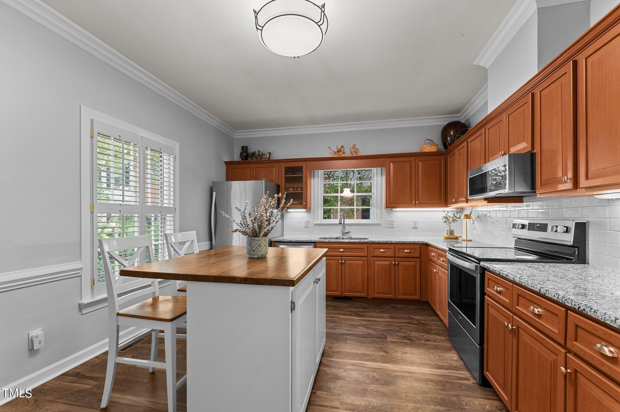 736 Weathergreen Drive Raleigh, NC 27615 - Photo 5 of 43 a kitchen with granite countertop lots of counter top space