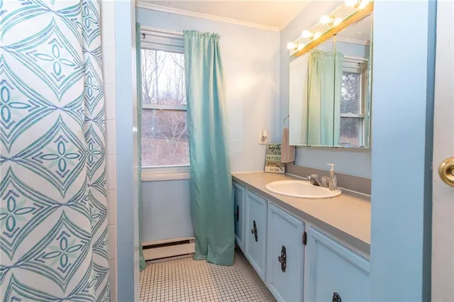 a bathroom with a double vanity sink and a mirror