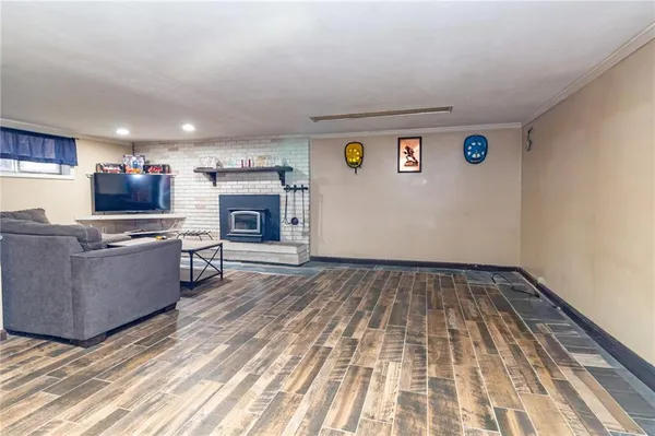 a view of kitchen with sink microwave and stove top oven
