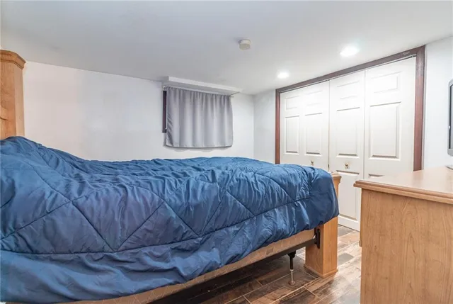 a bedroom with a bed and window