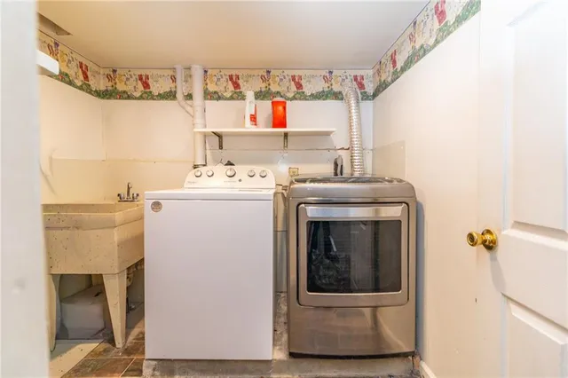 a utility room with dryer and washer