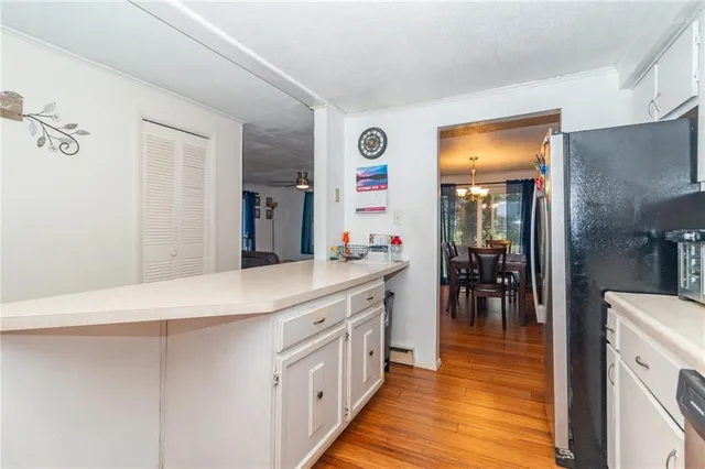 a kitchen with stainless steel appliances a sink and a refrigerator