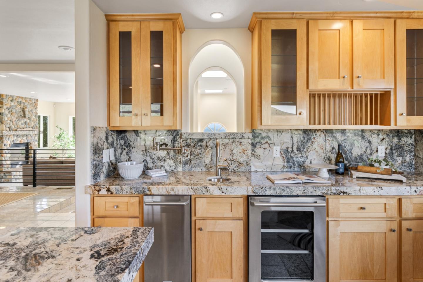 320 El Caminito Road Carmel Valley, CA 93924 - Photo 23 of 62 a kitchen with stainless steel appliances granite countertop a stove a sink and a microwave