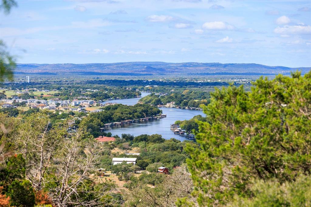 Undisclosed Address Burnet, TX 78611 - Photo 19 of 29 a view of a lake with a mountain in the background