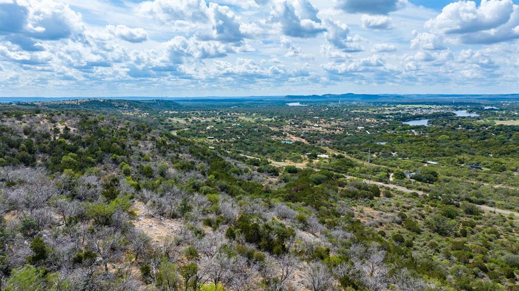 Undisclosed Address Burnet, TX 78611 - Photo 21 of 29 a view of a city with lush green forest