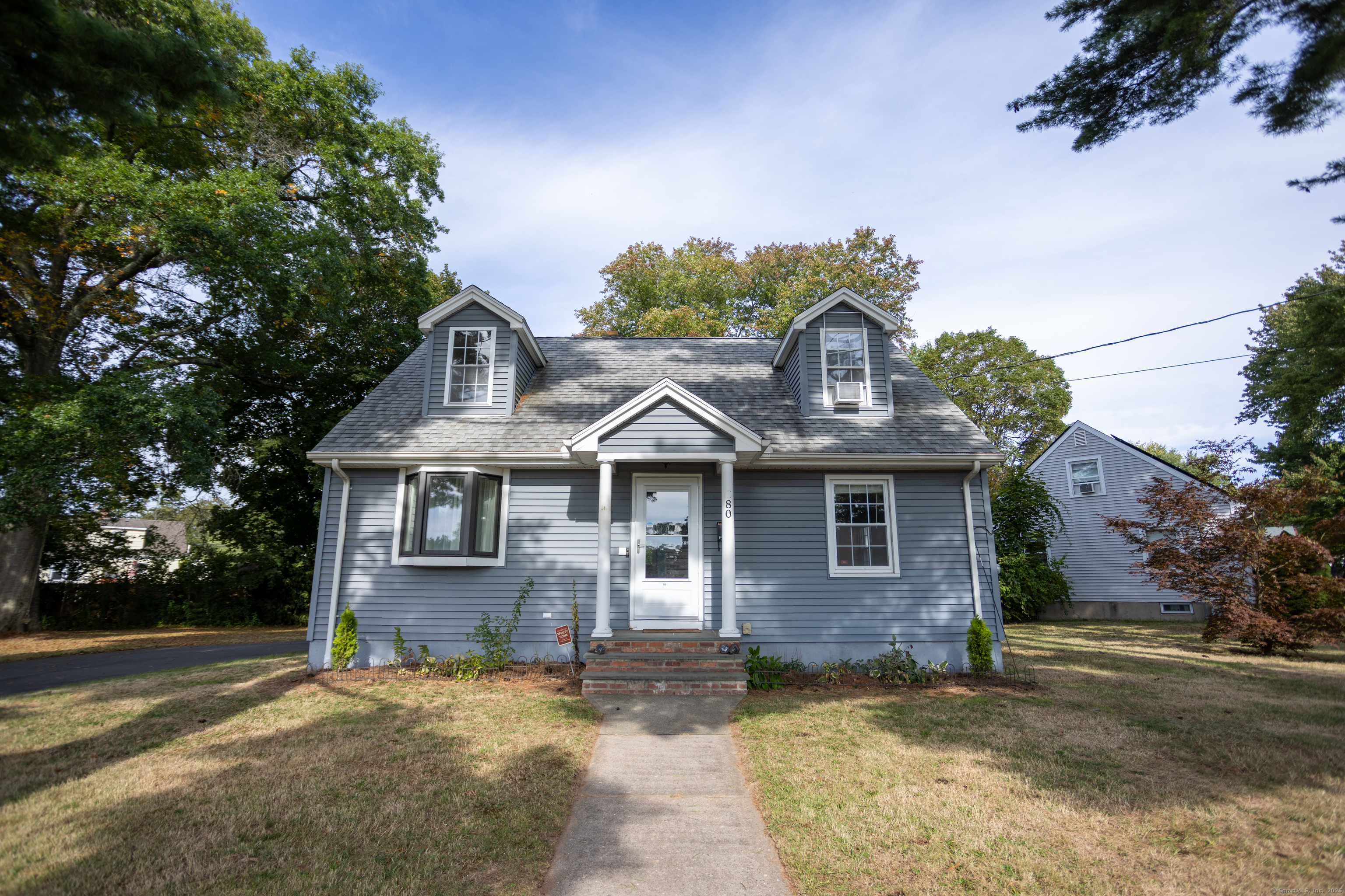80 Noble Street Hamden, CT 06514 - Photo 1 of 22 a front view of a house with a yard and garage