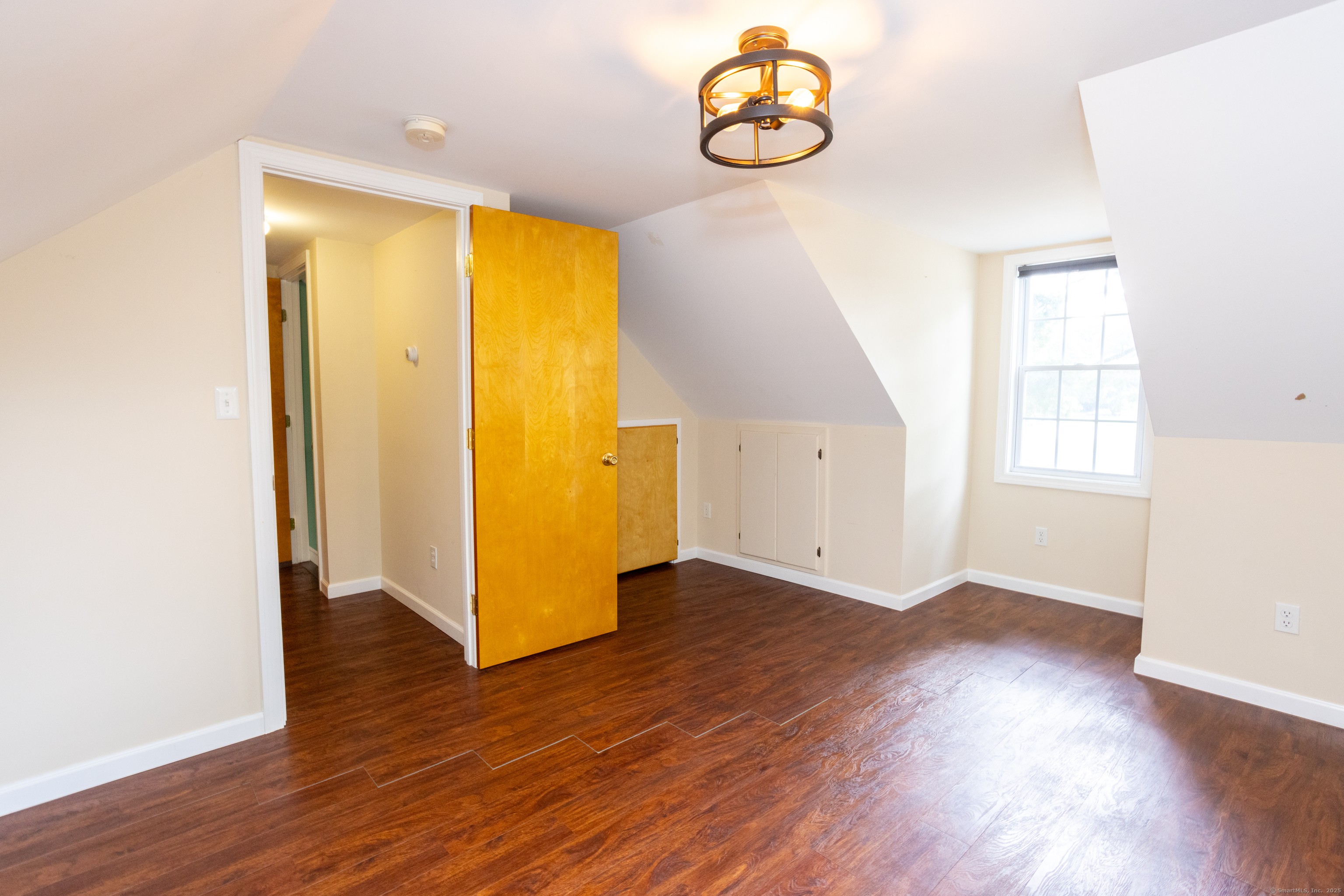 80 Noble Street Hamden, CT 06514 - Photo 13 of 22 an empty room with wooden floor and windows
