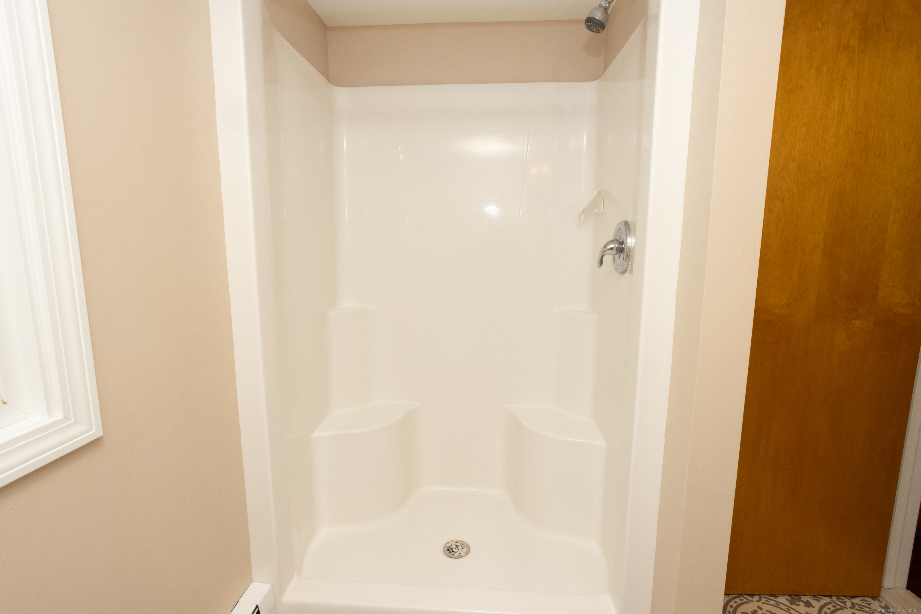 80 Noble Street Hamden, CT 06514 - Photo 15 of 22 a bathroom with a glass shower door