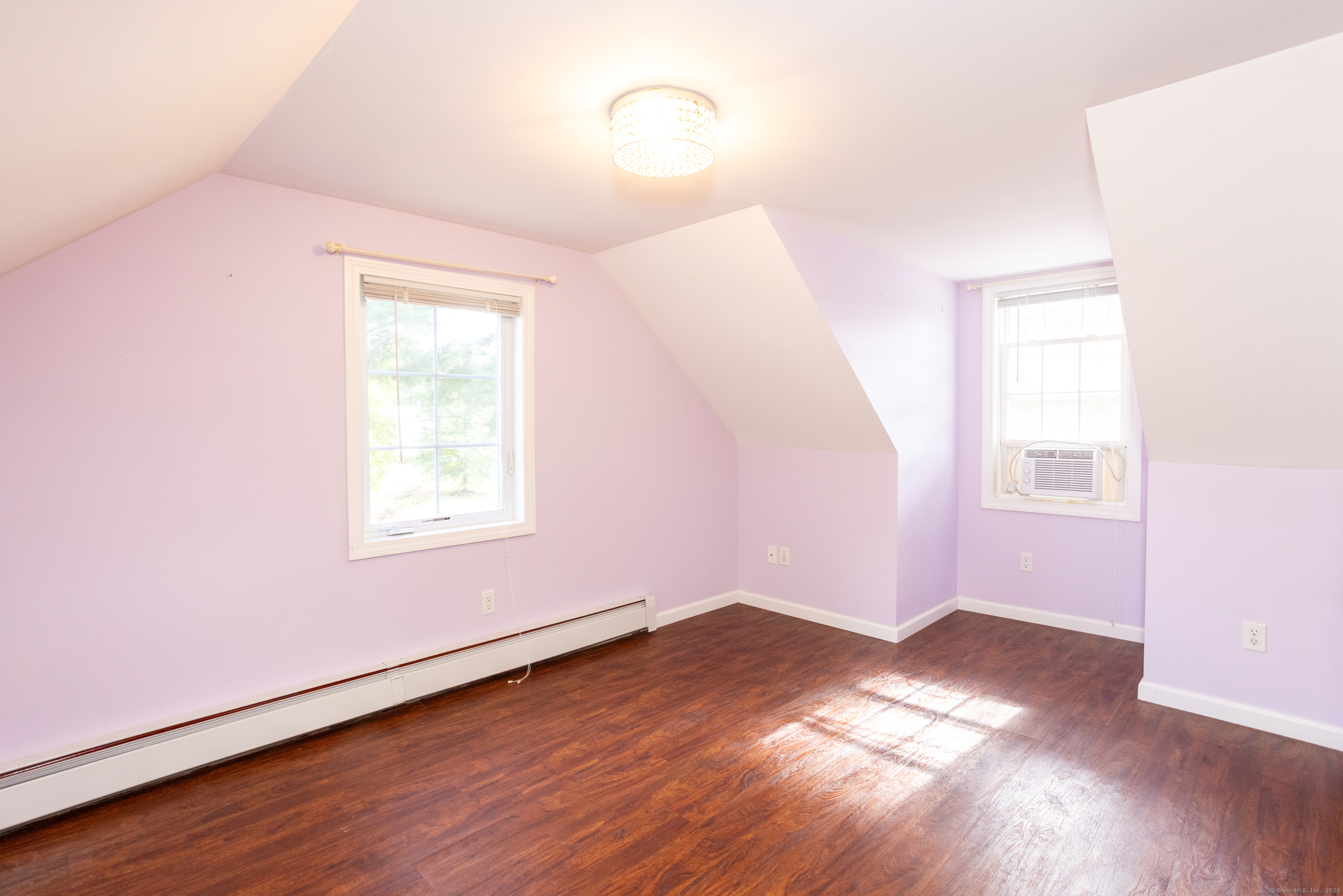 80 Noble Street Hamden, CT 06514 - Photo 16 of 22 an empty room with wooden floor and windows