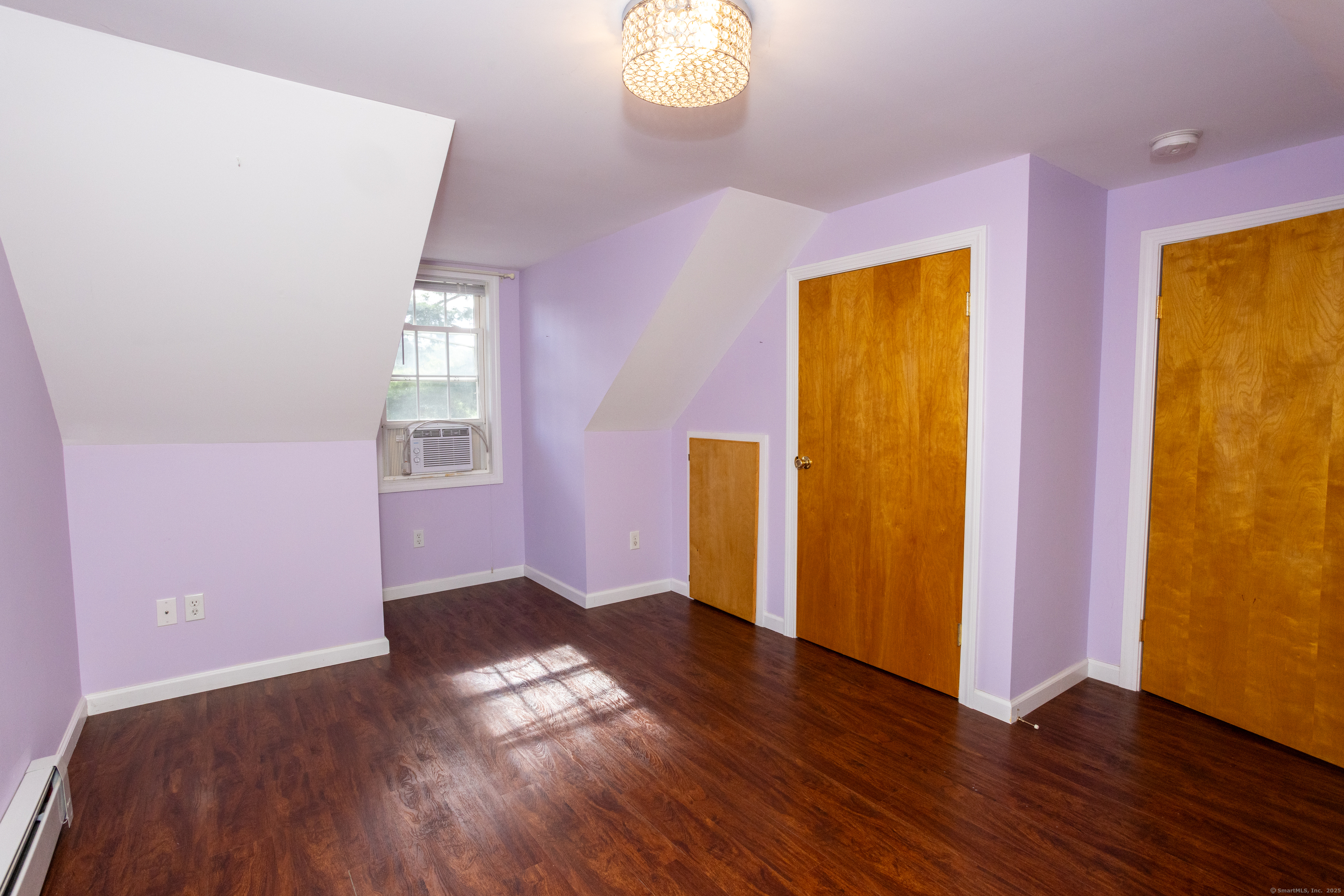 80 Noble Street Hamden, CT 06514 - Photo 18 of 22 an empty room with wooden floor and windows