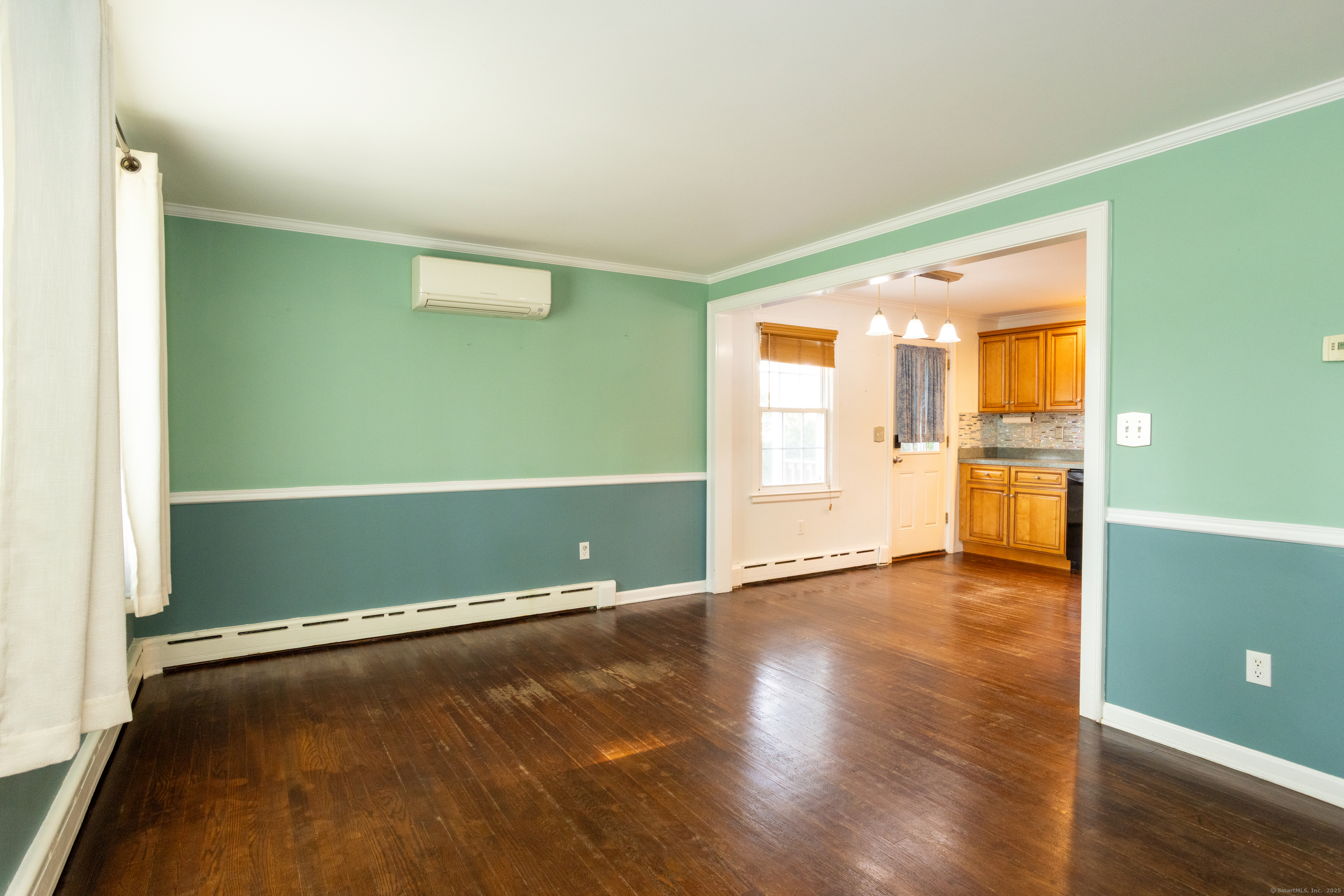 80 Noble Street Hamden, CT 06514 - Photo 5 of 22 an empty room with wooden floor and windows