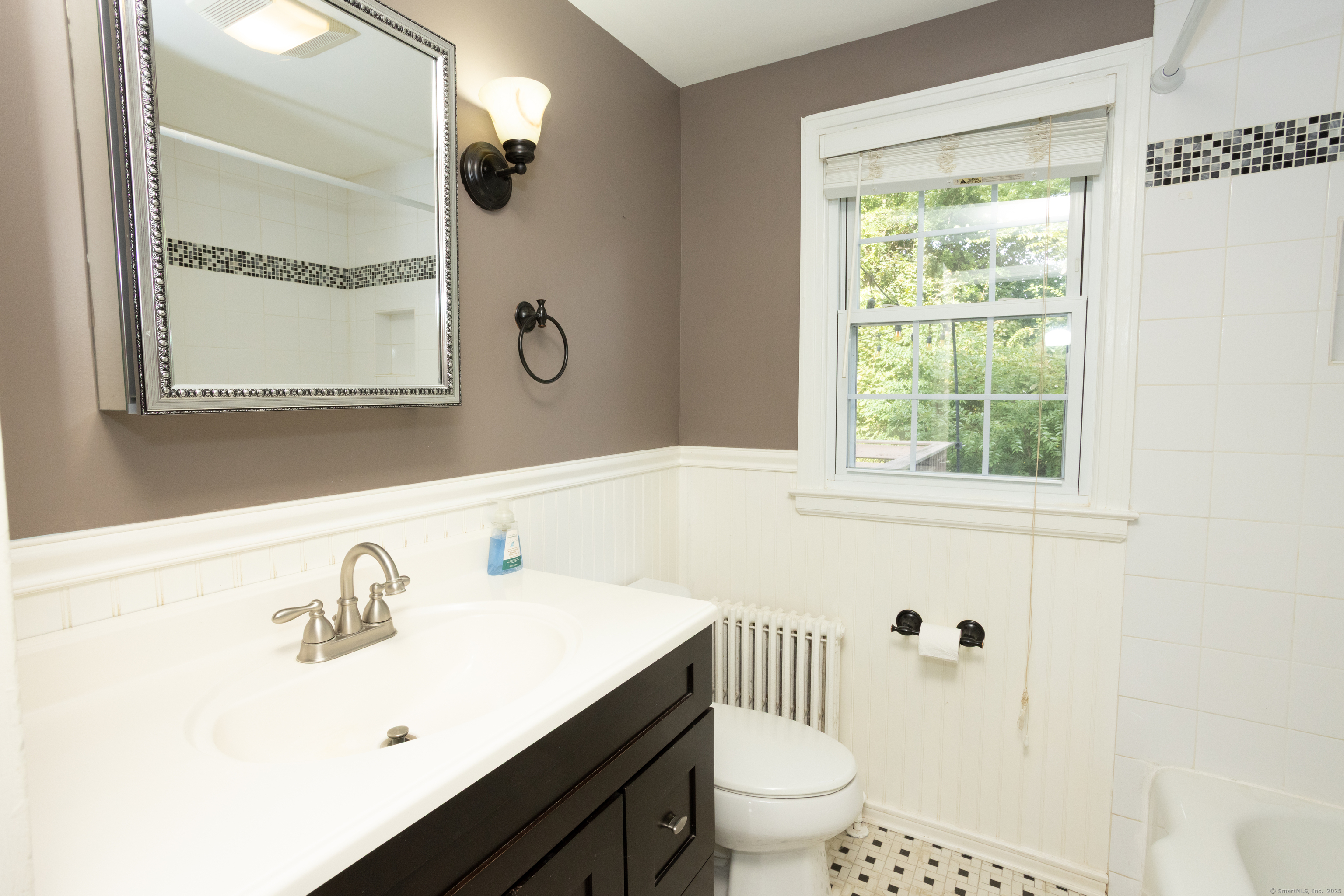 80 Noble Street Hamden, CT 06514 - Photo 10 of 22 a bathroom with a sink toilet and a mirror