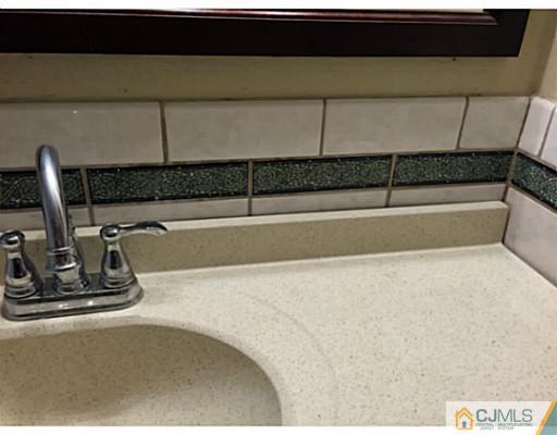21 Albemarle Road Colonia, NJ 07067 - Photo 7 of 22 a view of a sink with a faucet