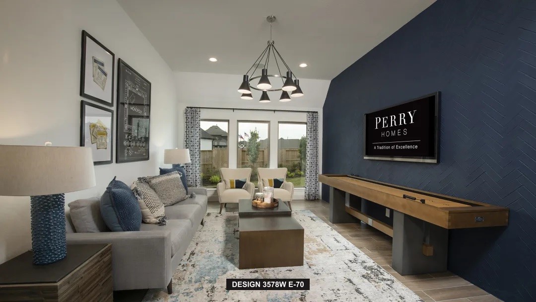 5302 Dream Court Manvel, TX 77578 - Photo 11 of 20 a living room with furniture and a chandelier