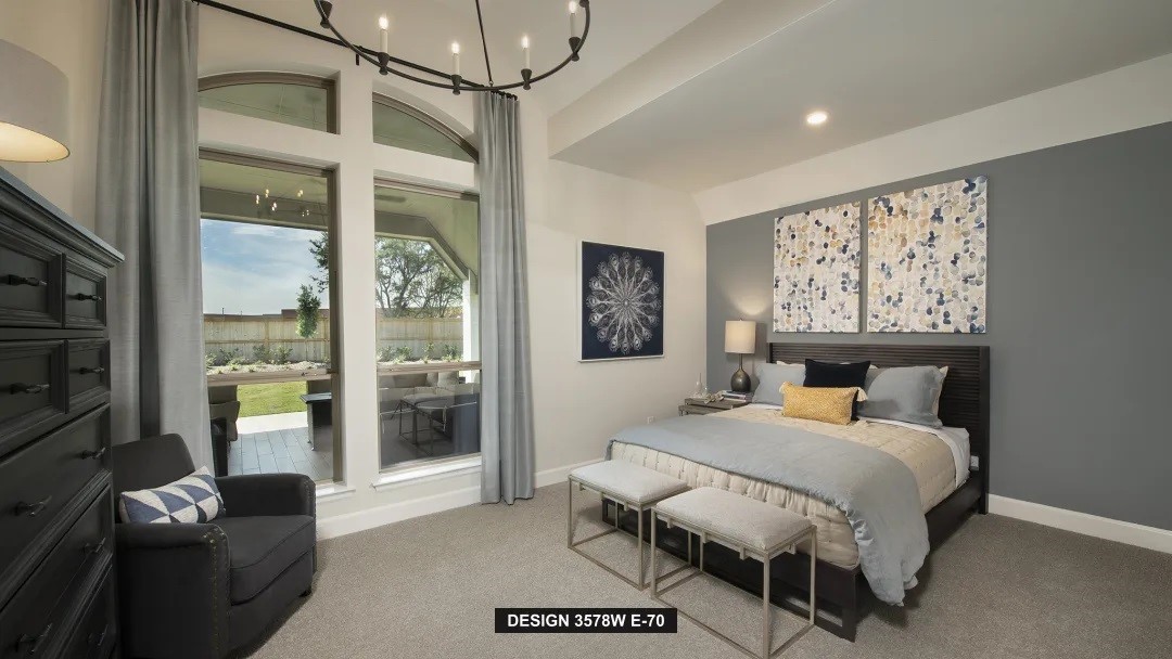 5302 Dream Court Manvel, TX 77578 - Photo 9 of 20 a bedroom with a bed couch and a window