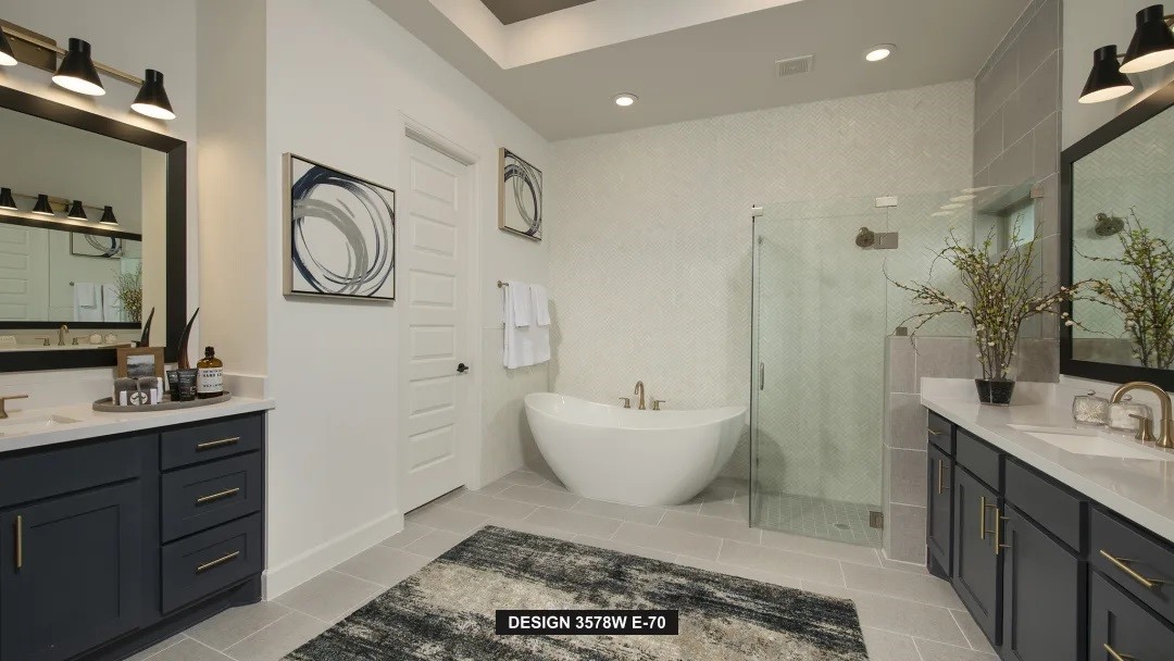 5302 Dream Court Manvel, TX 77578 - Photo 10 of 20 a spacious bathroom with a double vanity sink mirror and bathtub