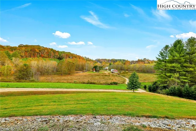 a view of a garden with a building in the background