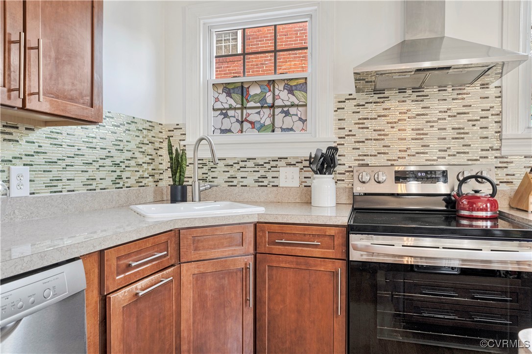 1908 Seddon Road Richmond, VA 23227 - Photo 14 of 34 Kitchen with wall chimney range hood, light counte