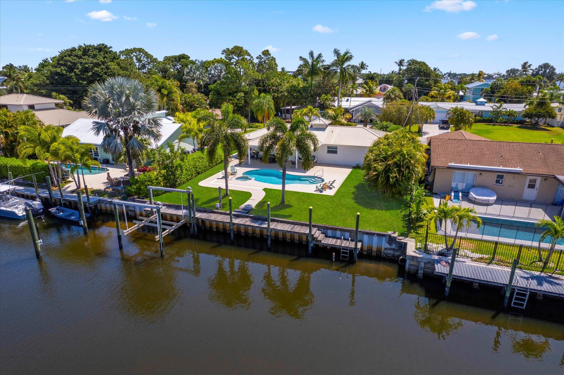 1389 Southwest Dyer Point Road Palm City, FL 34990 - Photo 1 of 55 swimming pool view with a lake view