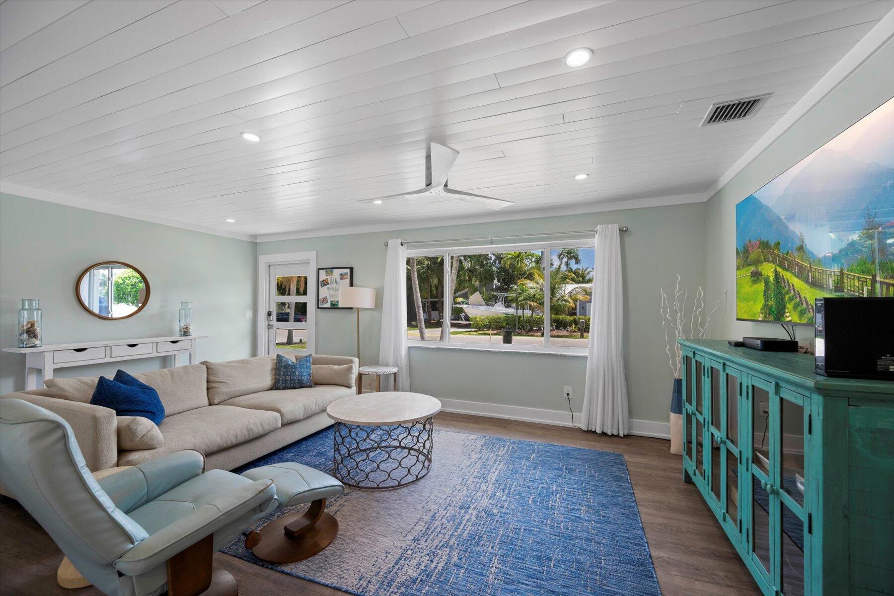 1389 Southwest Dyer Point Road Palm City, FL 34990 - Photo 11 of 55 a living room with furniture and a window